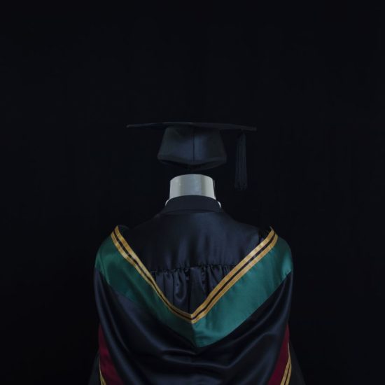 attaching hood to graduation gown